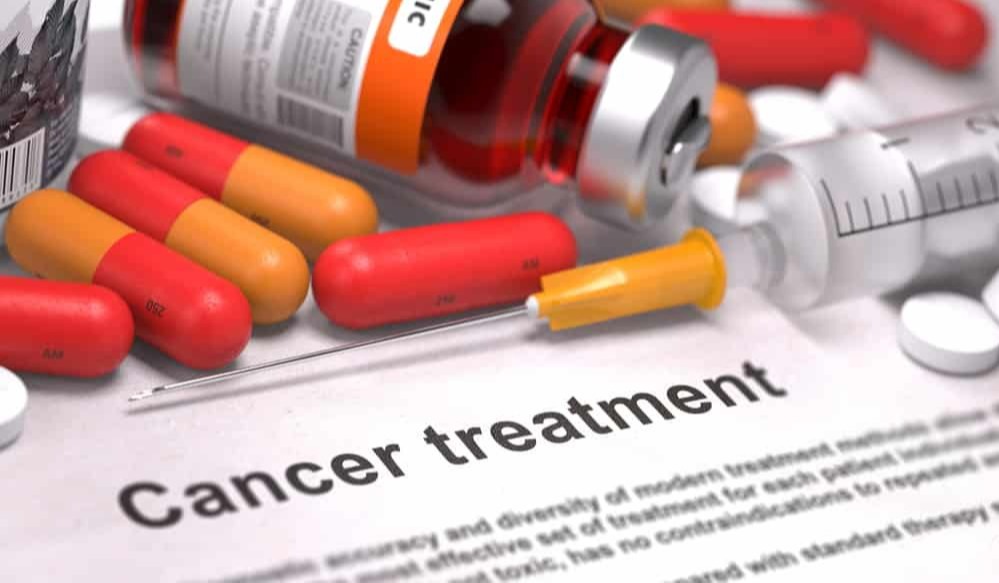 Cancer Treatment - Medical Concept with Red Pills, Injections and Syringe- Selective Focus- 3D Render--1-1