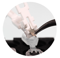 a close up photo of the micro blade being removed from the harpera microbiopsy punch tool