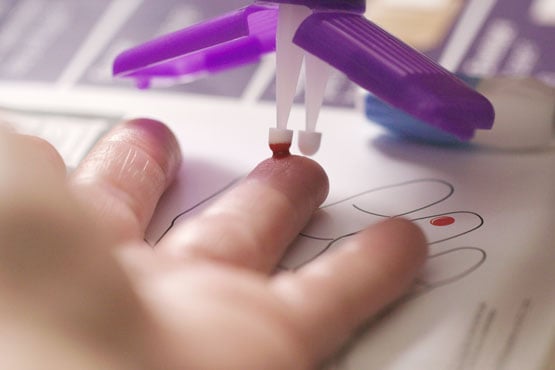 at home blood sample collection, a mitra microsampler collects a drop of capillary blood from a finger tip