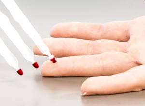 Collecting a drops of blood from a finger prick with the Mitra microsampler