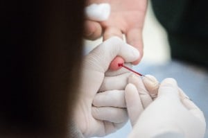 Finger stick blood test and collection